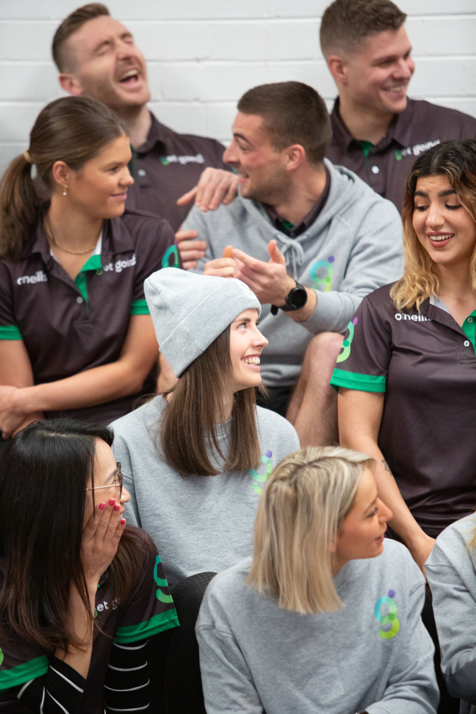 Get Going trainers laughing together at a team event